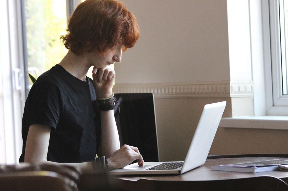 Young person with computer