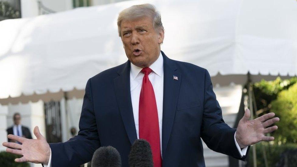 US President Donald Trump speaks to the media before departing the White House