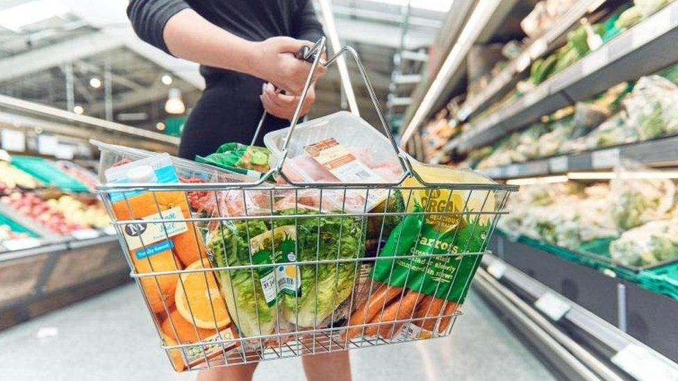 Woman holding shopping basket