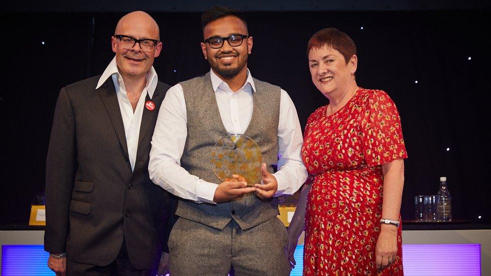 Abed Ahmed at the awards between comedian Harry Hill and TES editor Ann Mroz