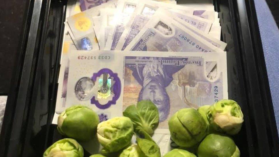 Cash under a pile of Brussels sprouts