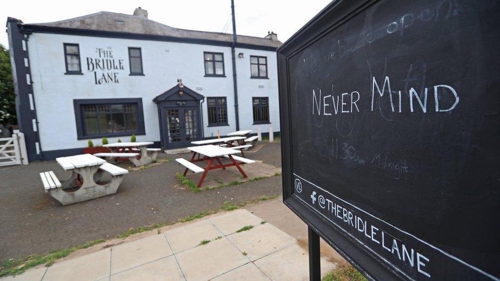 Sign saying "never mind" outside the Bridle Lane Tavern in Leicester on 4 July