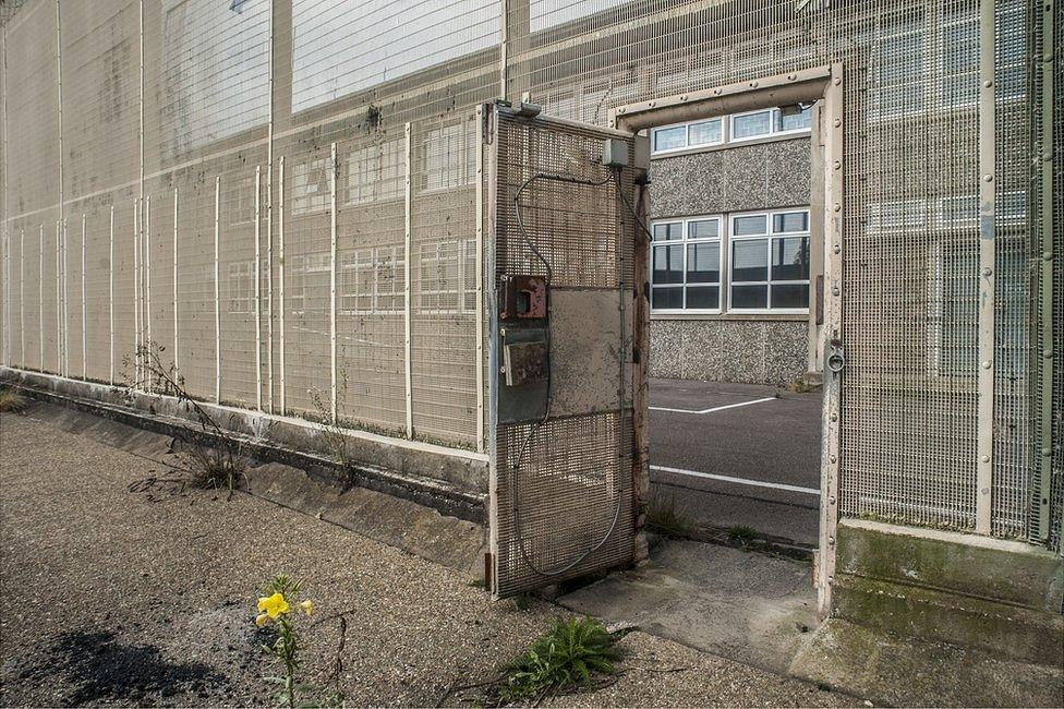 Gate to one of the exercise yards for one of the wings