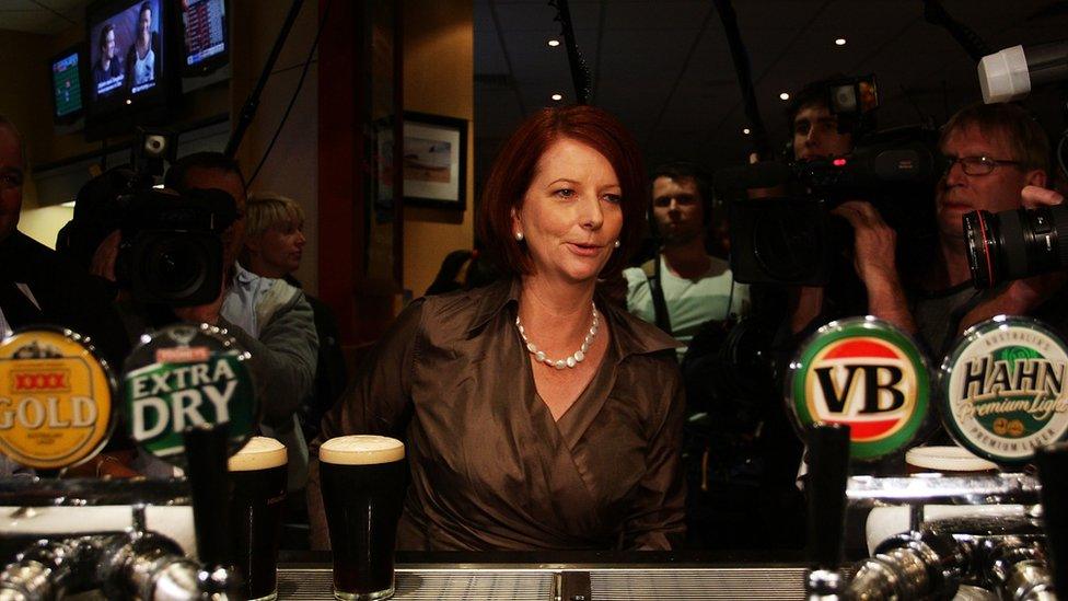 Julia Gillard at the bar in a pub on the campaign trail in 2010