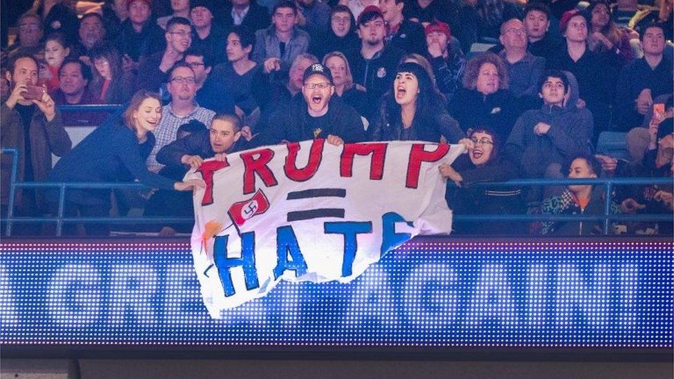 Demonstrators react after learning a rally for Republican presidential candidate Donald Trump