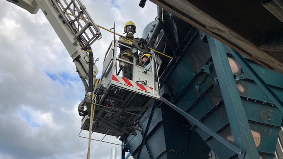 Firefighter on an aerial ladder