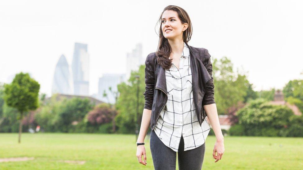 Woman walking in a park