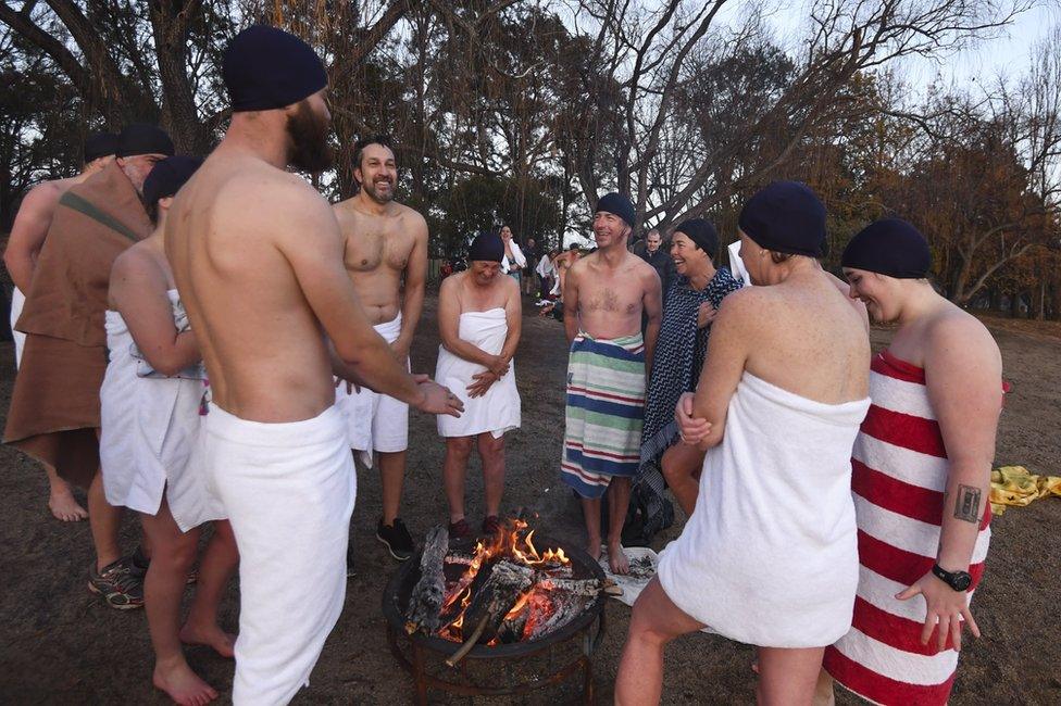 Swimmers take part in the Winter Solstice Nude Charity Swim in Canberra