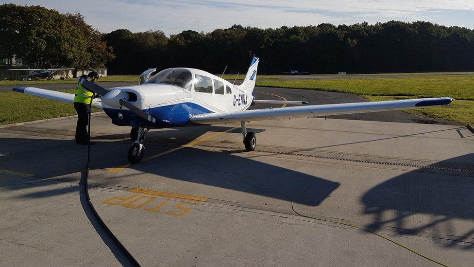 A pupil at EFG Flight School conducts maintenance on an aeroplane