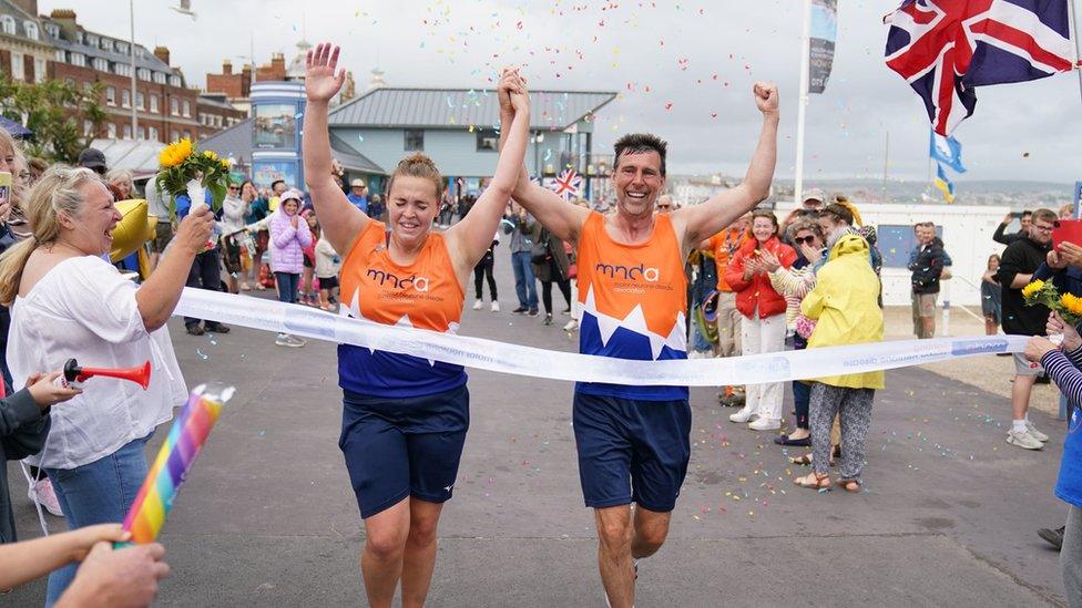 Charlotte Nichols and Stuart Bates finished the marathon at Weymouth Beach, completing their challenge to take part in all 102 Olympic sports