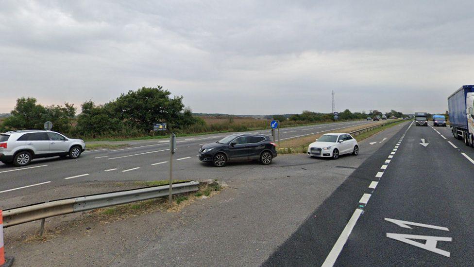 Cars waiting to drive through the gaps on the A1 with traffic travelling in both directions