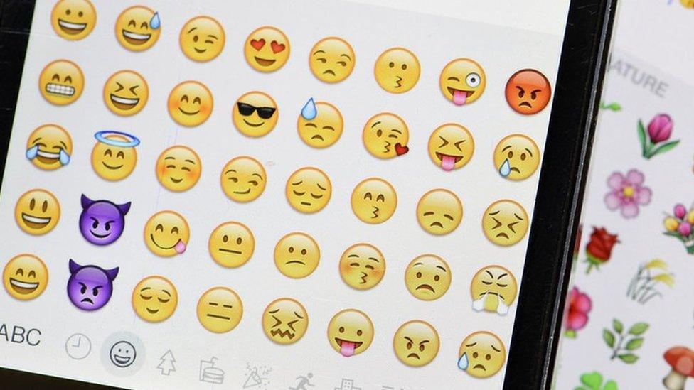 A smartphone emoji keyboard