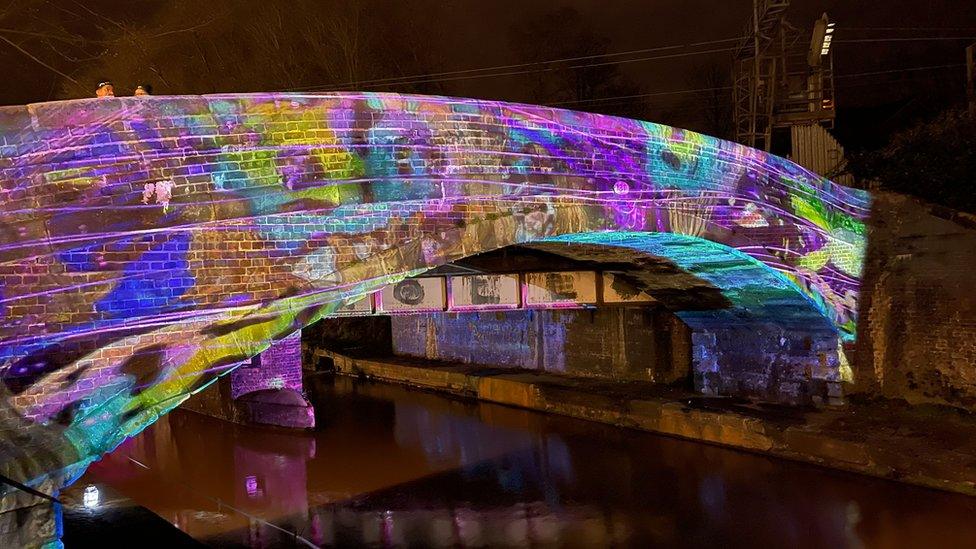 Light projection on a railway tunnel