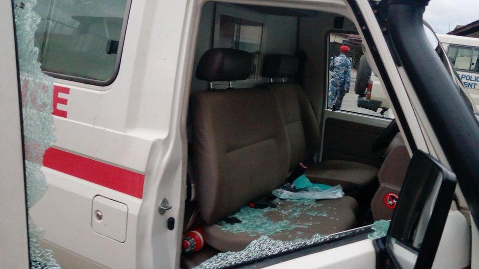 Image shows a damaged Red Cross ambulance