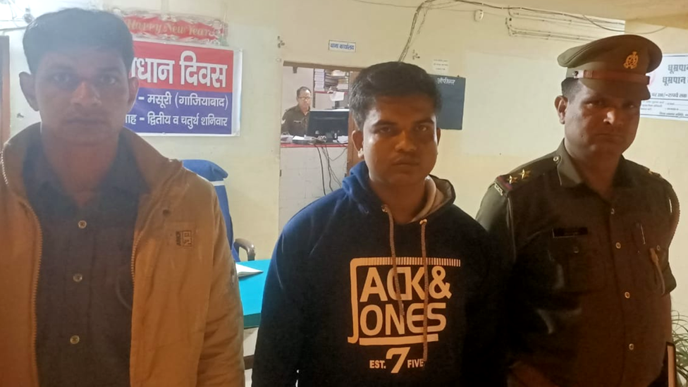 The suspect, named by police as Shringi Nandan Yadav (centre)