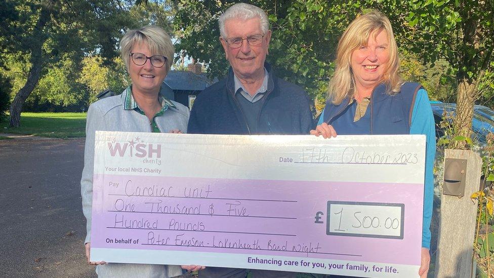 Peter Empson with daughters Beverley and Sandra, holding the cheque for My WiSH Charity