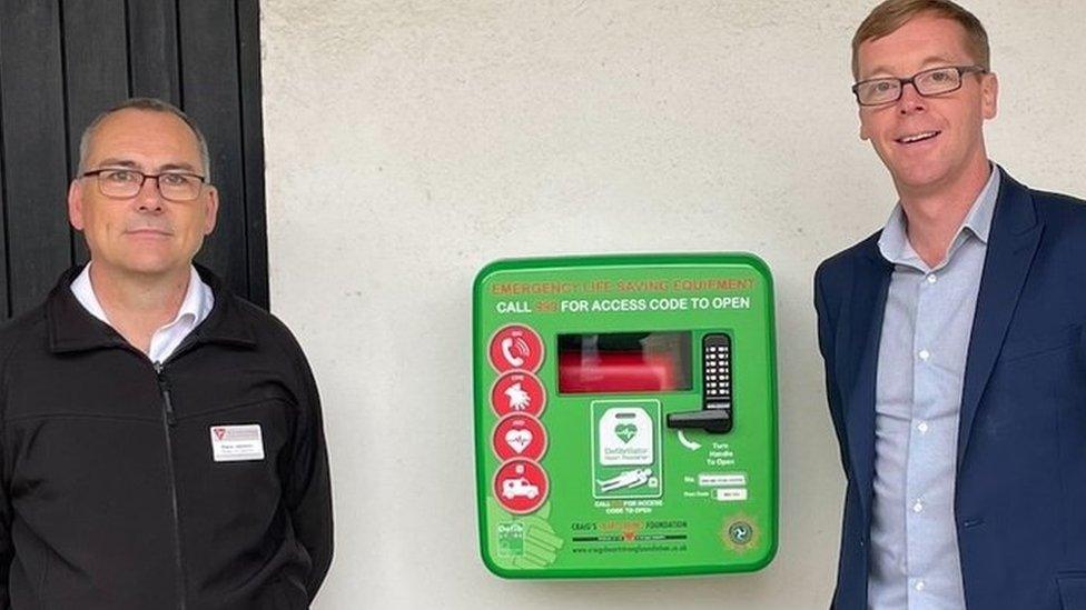 Steve Jackson of MNH and Paul Healey of Craig’s Heartstrong Foundation, with the new defibrillator at the House of Manannan