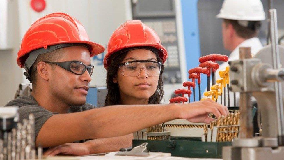 Man and woman in hard hats