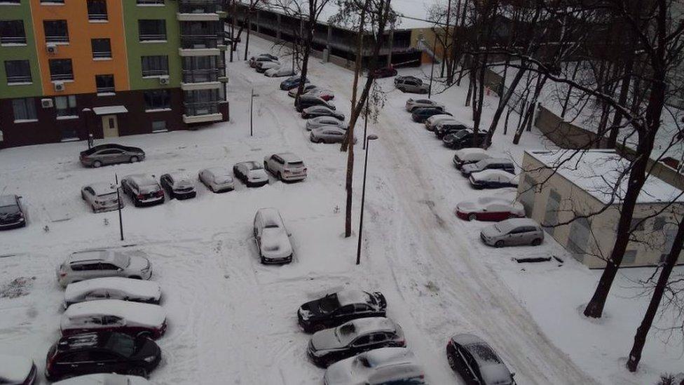 Cars in Kiev, Ukraine under a covering of snow.