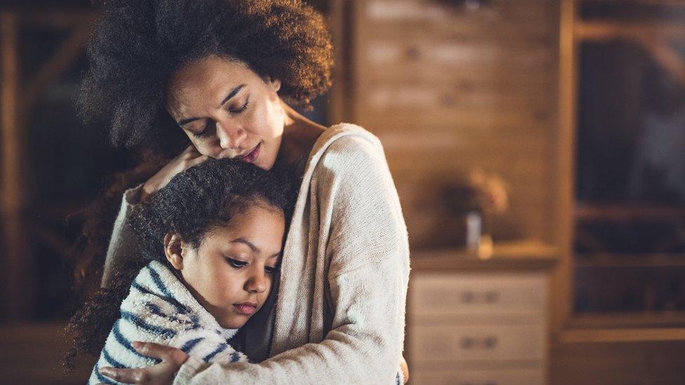 A mum and daughter hug