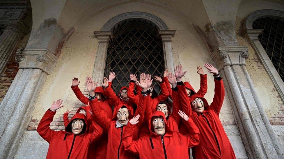 A group of revellers dressed as characters from Netflix's La Casa de Papel (Money Heist)