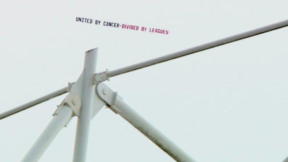 Banner being flown over Stadium of Light