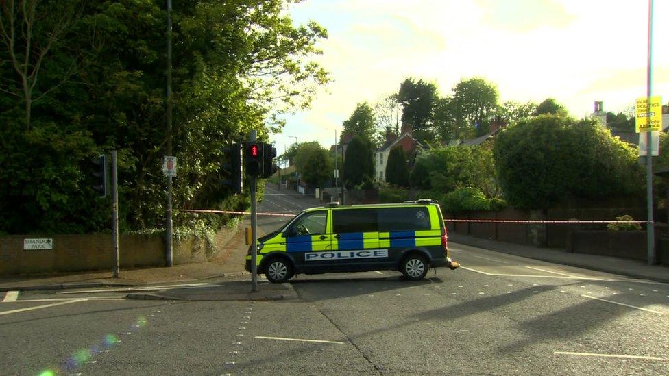 police car at end of the road