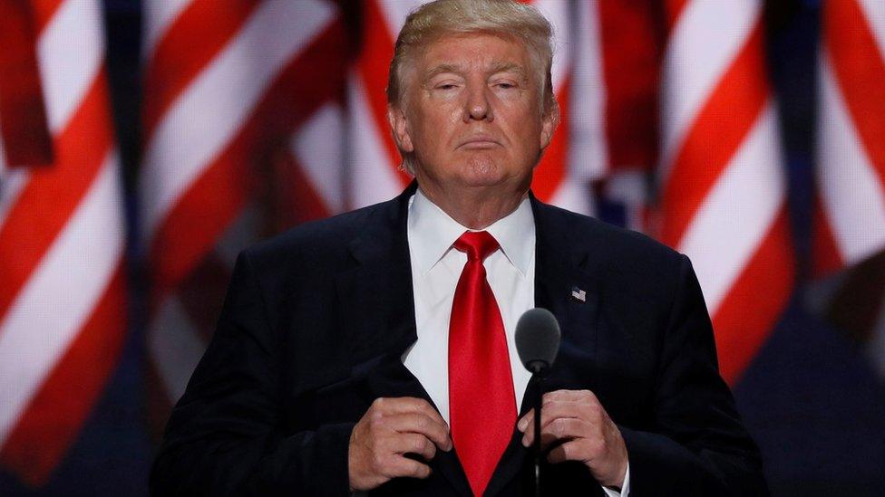 Republican U.S. presidential nominee Donald Trump adjusts his jacket as he speaks during the final session of the Republican National Convention in Cleveland, Ohio,