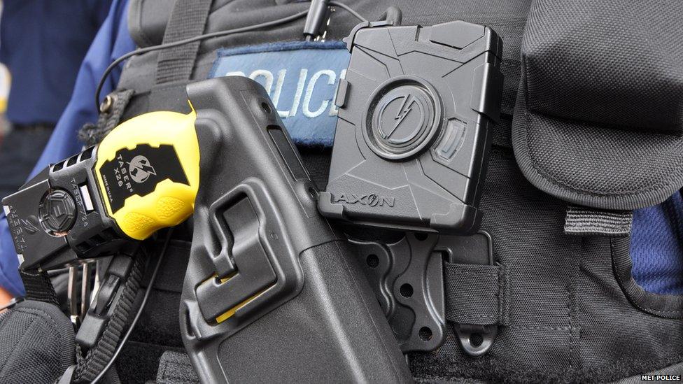 Police officer wearing taser in a holster