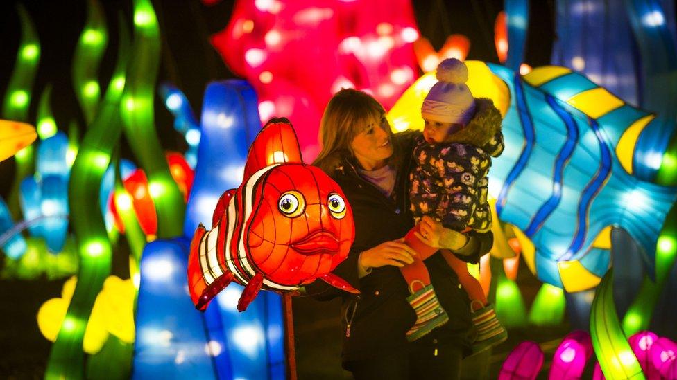 A young girl, her mother and a clown fish lantern