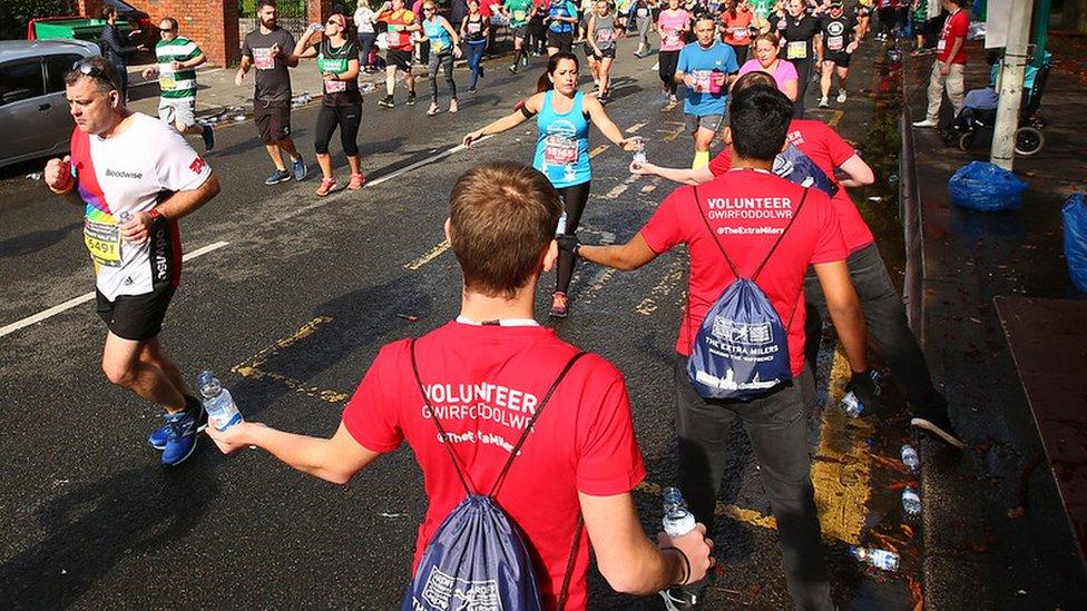 people handing out water