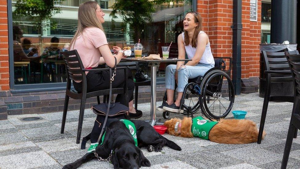 Jemima Banks and Isabelle Atkins with their assistance dogs