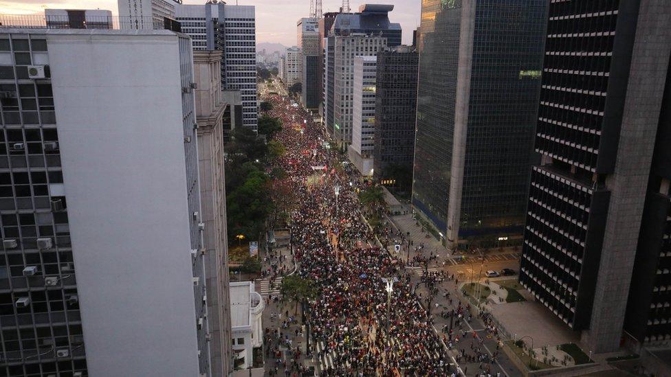 Seen from above, huge clouds march through the streets