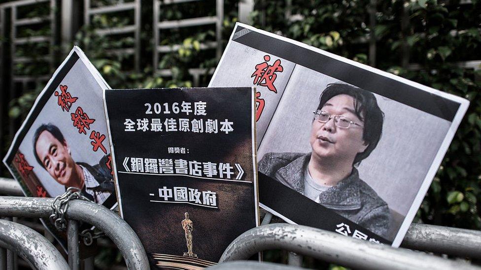 Placards showing missing bookseller Lee Bo (L) and his associate Gui Minhai (R)