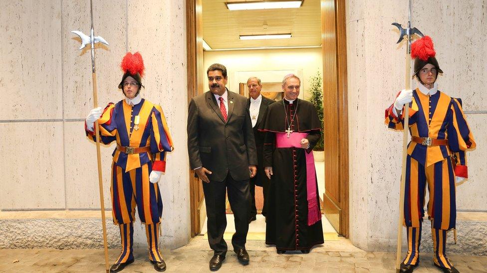 A handout picture provided by Miraflores Press shows Venezuelan President Nicolas Maduro (C-L) being received by Prefect of the Papal Household, German Archbishop Georg Gaenswein (C-R) prior to a private meeting between Maduro and Pope Francis, at the Vatican, 24 October 2016