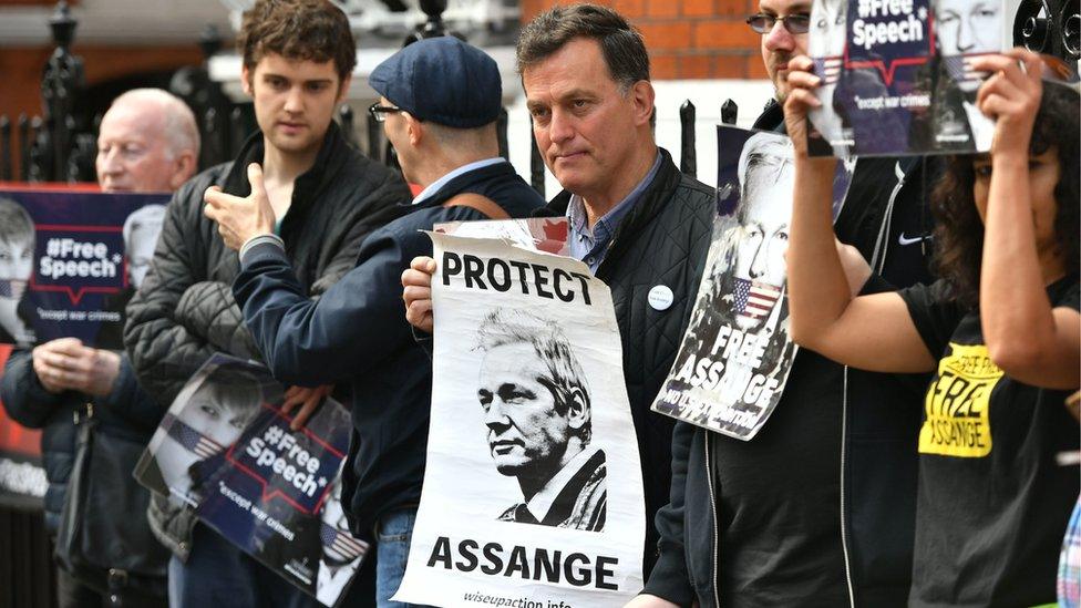 Protestors gather outside Ecuador's embassy in London