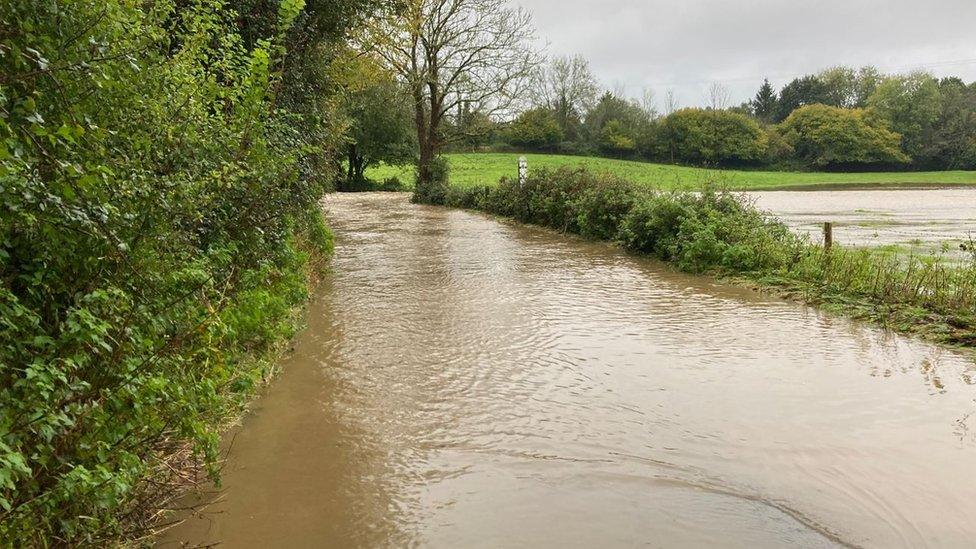 Floodwaters covering a road