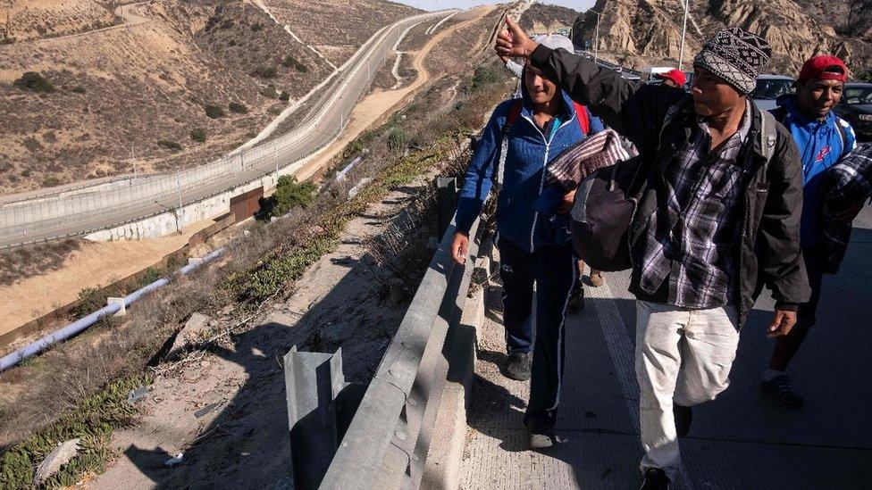 A group of migrants from poor Central American countries - mostly Hondurans - moving towards the United States are seen near the US border in Tijuana, Mexico