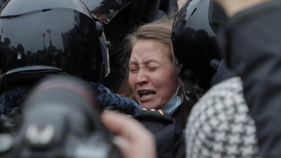 Russian special police units officers detain a protester during an unauthorized protest in support of Russian opposition leader