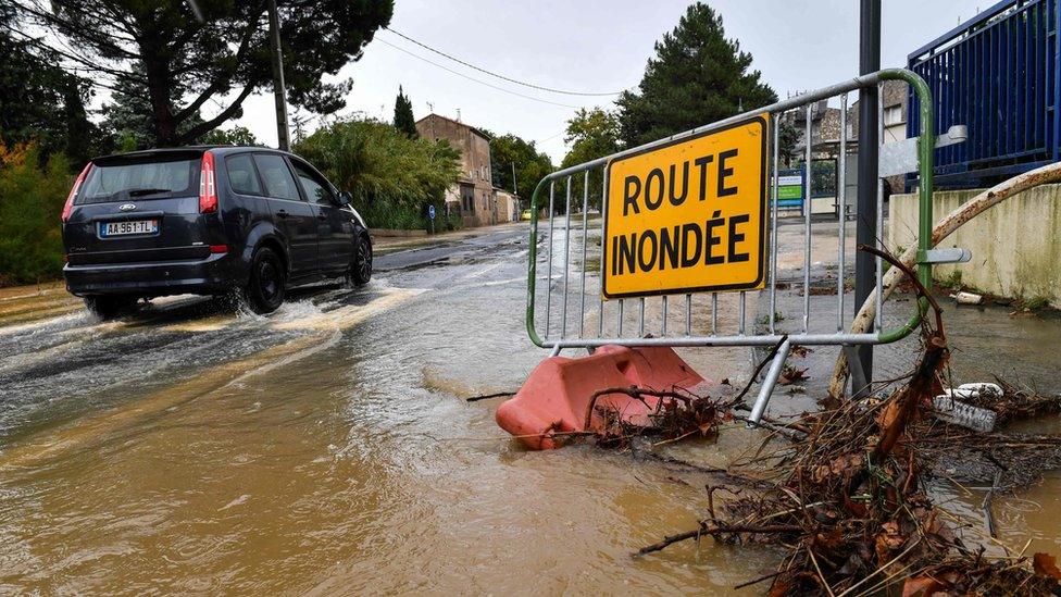 Sign reading 'flooded street'