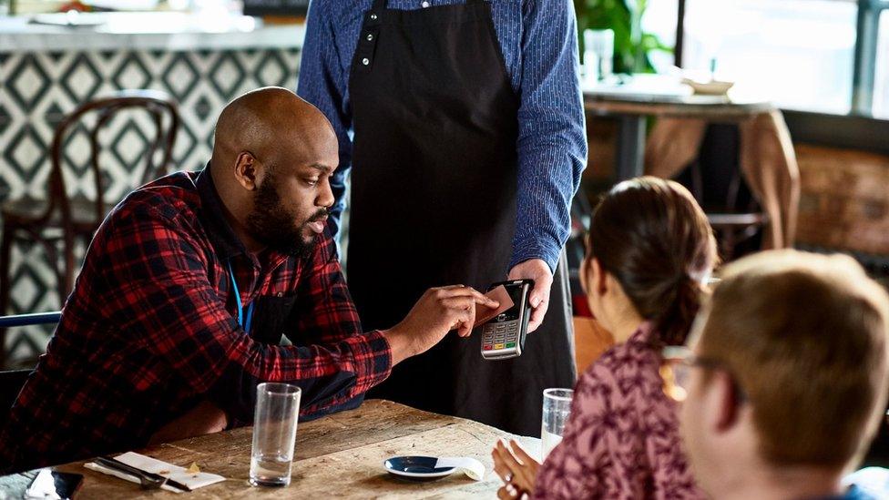 Man paying for meal