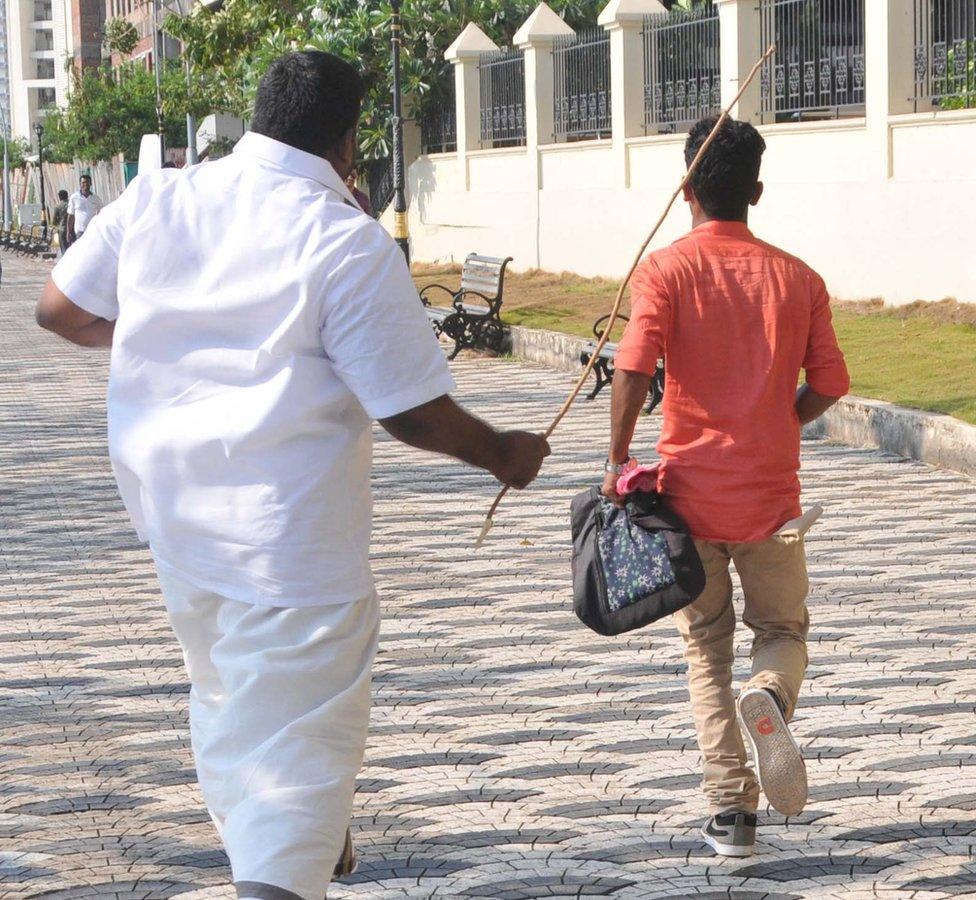 Shiv Sena members chase a young boy