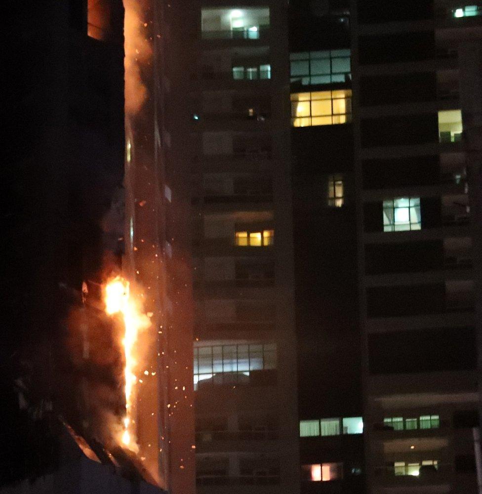 Flames shoot up the Torch Tower in Dubai