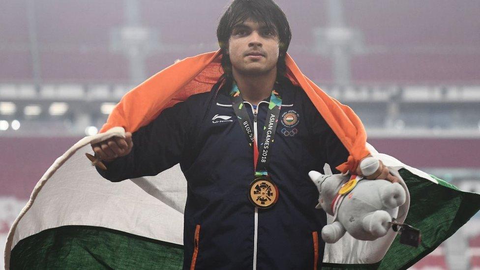 Gold medallist India"s Neeraj Chopra celebrates during the victory ceremony for the men"s javelin throw athletics event during the 2018 Asian Games in Jakarta on August 27, 2018