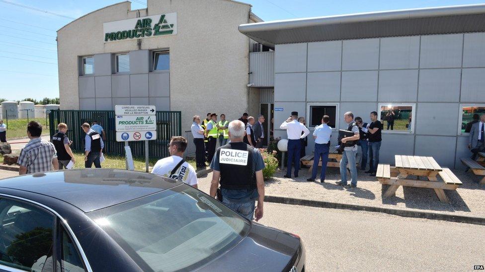 Handout photo of police investigators outside Air Products factory in Saint-Quentin-Fallavier, southeast of Lyon, on 26 June 2015