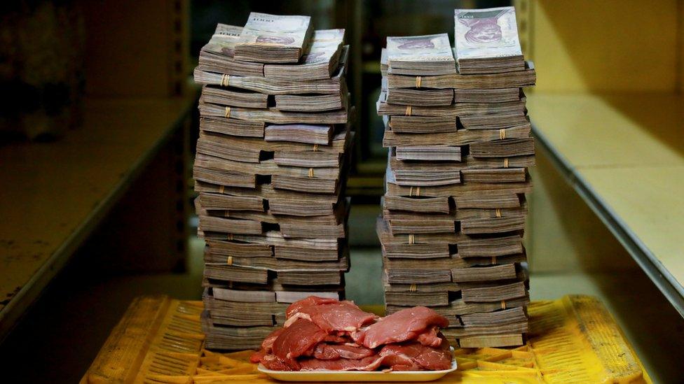 1kg of meat is pictured next to 9.5 million bolivars - its price and the equivalent of $1.45 in Caracas on 16 August 2018