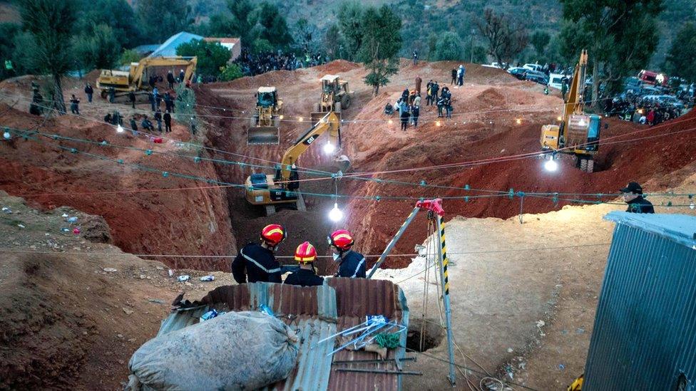 Firefighters work to rescue five-year-old Rayan, who became trapped in a deep well for days in Morocco's rural northern province of Chefchaouen