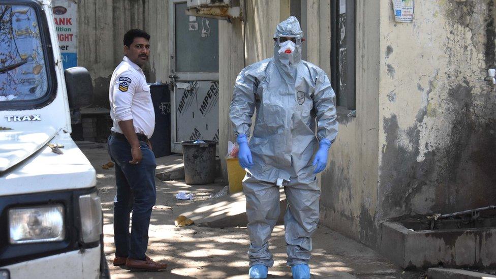 A health worker in PPE