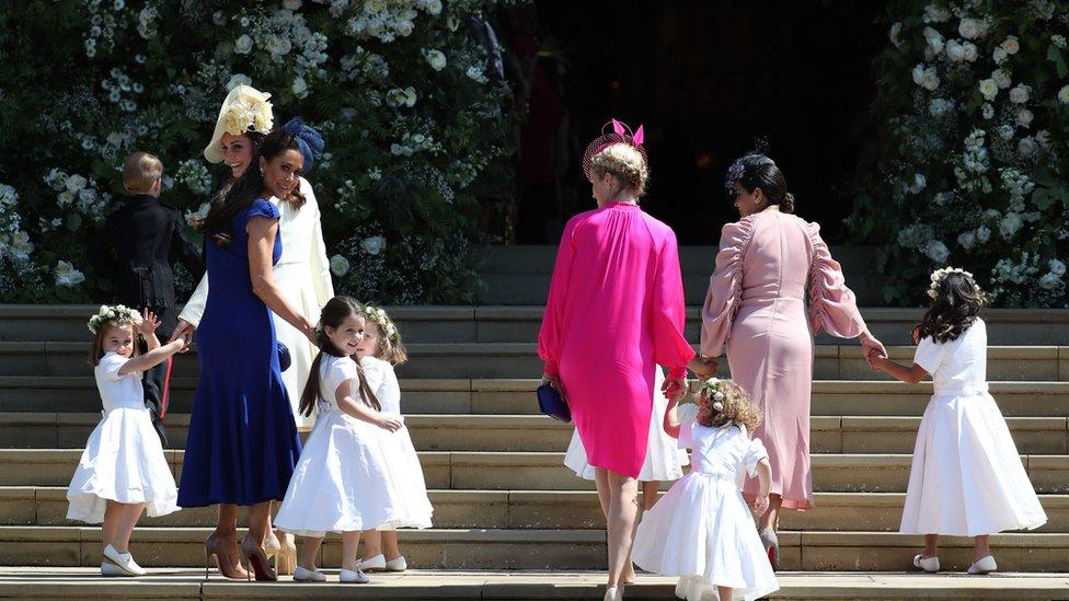 Pagesboys and bridemaids on steps of St George's Chapel