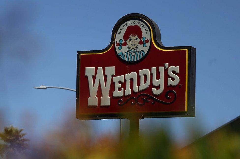 A sign for a Wendy's restaurant